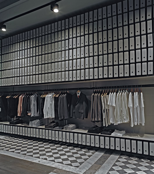 Archive boxes and a chequered floor in the fitout for Melbourne fashion designer James Cameron explored ideas of pattern and repetition. Photo by Scottie Cameron