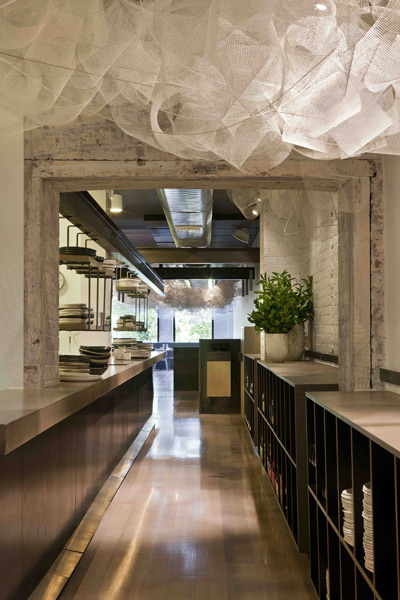 The kitchen at Tonka is positioned in the centre of the long, narrow tenancy – a mediator between the bar and dining zones