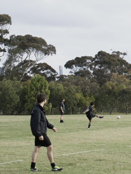 The 2013/14 Fender Katsalidis team warm up as Eureka tower looms in the background.