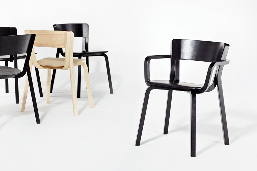 The Para armchair and stacking chair, made from moulded rubberwood ply and designed by Adam Goodrum