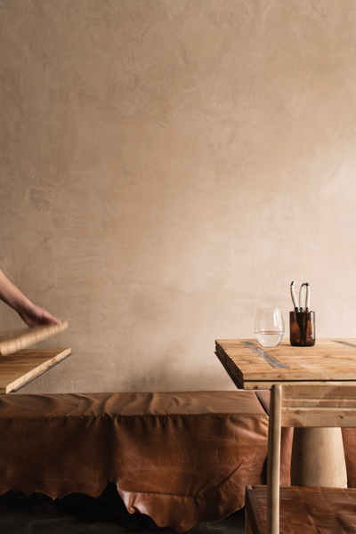 Hinged sections in the communal dining table at Farmhouse allow easy access within the small space