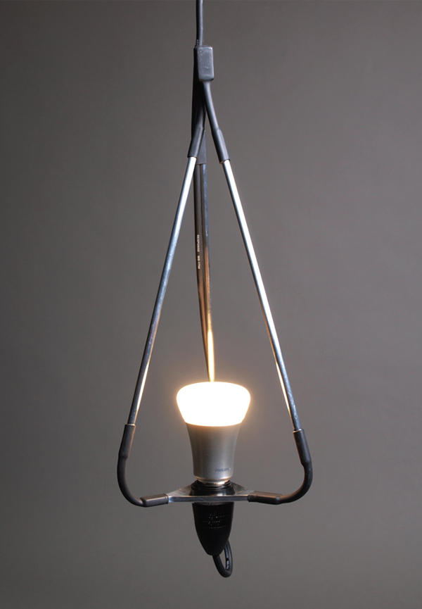 The fully articulated Spyder lamp utilises magnetic legs to bundle together as a pendant or sprawl across metal surfaces
