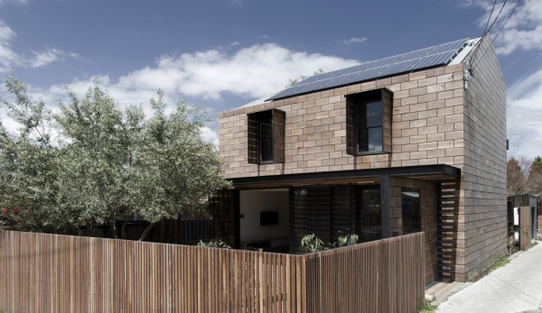 A hinged ground floor facade opens to the street