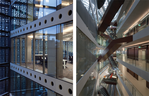 The facade's angular form veils the internal program, while stair access ways slice across the atrium space.