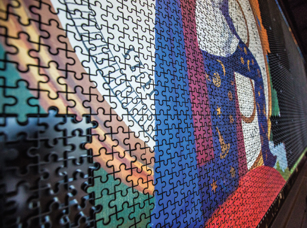 Over a six-month period pieces are being added to vast colourful jigsaw that sits on the wall opposite the skyline view. When completed it will reveal Heston Blumenthal being centre stage.