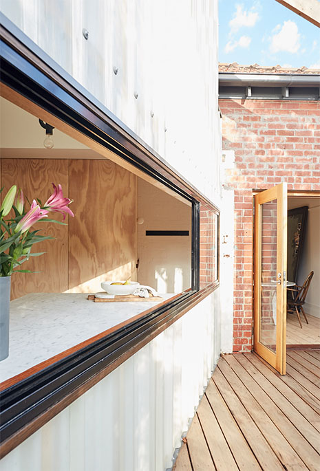 The kitchen looks out to the garden.