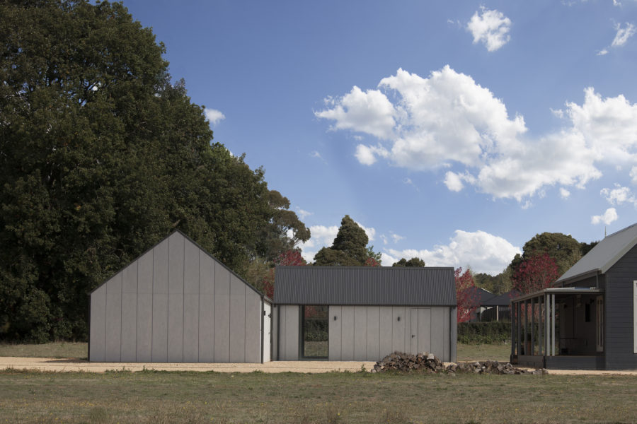 The new buildings create a central courtyard for the existing dwelling. 