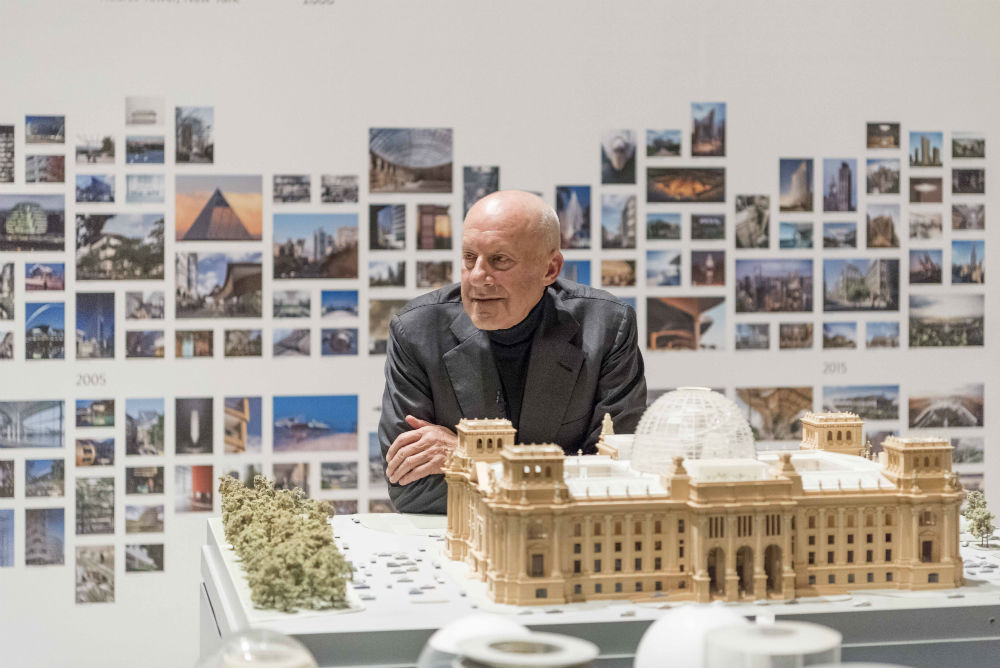 Norman Foster with a model of the Reichstag. Image by Nigel Young.