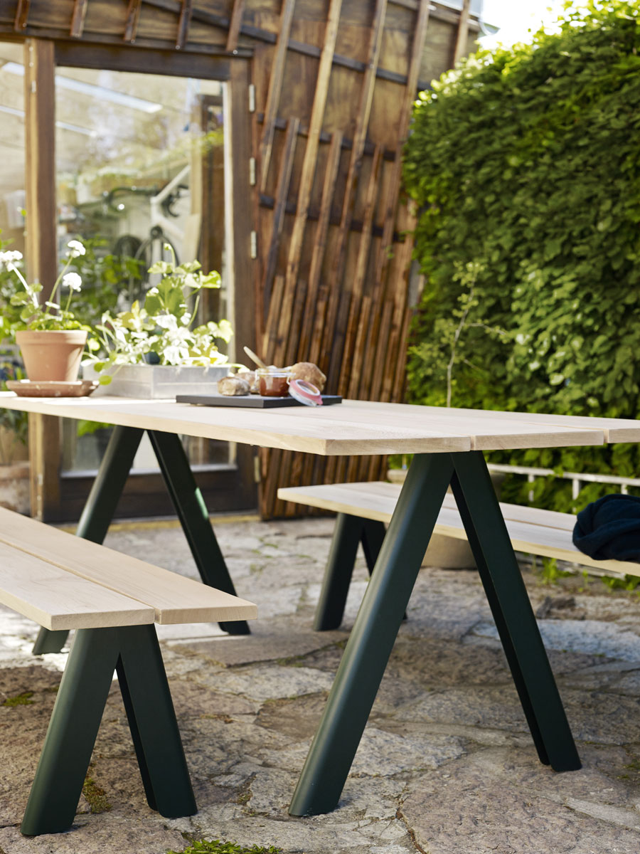 The Overlap table and bench seat in hunter green.