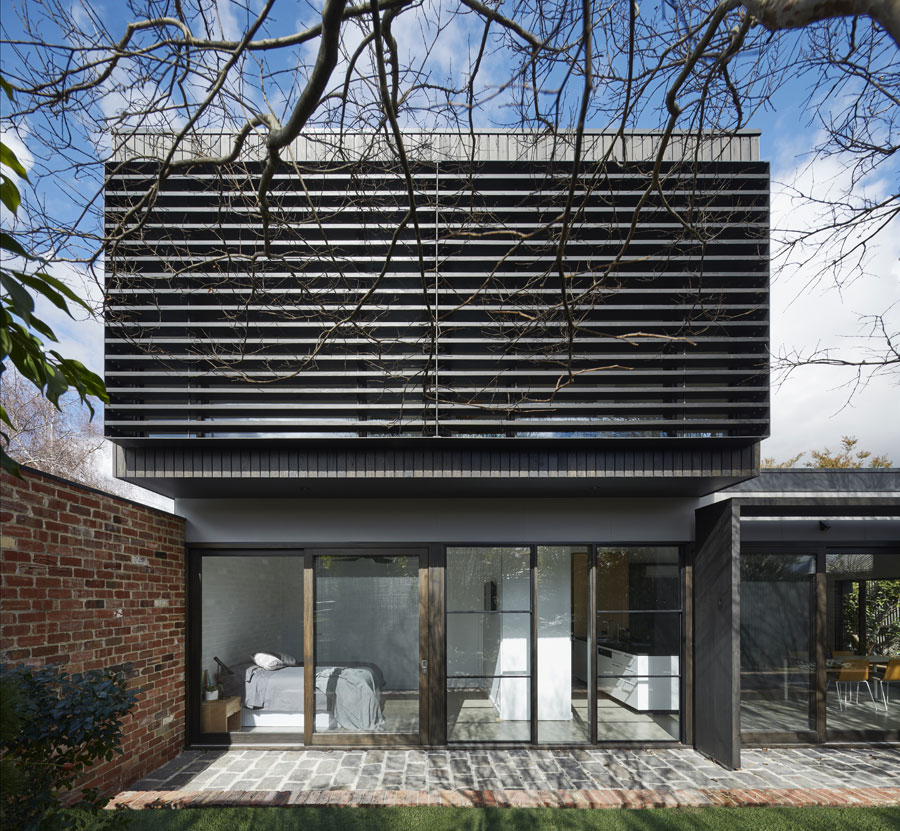 The new two-storey home includes a wall of glass along the northern façade.