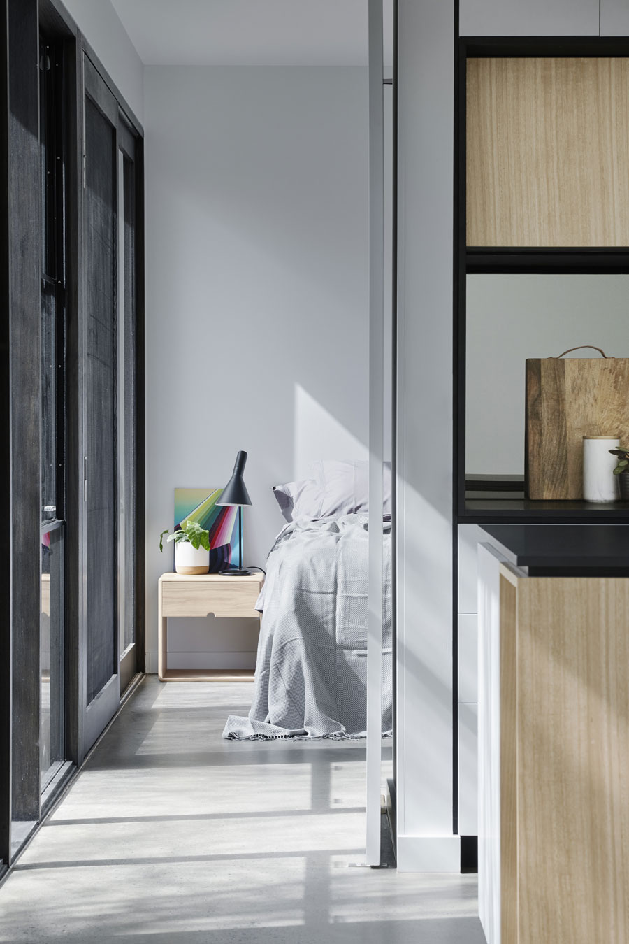 The bedroom can be closed off from the main living area with a large pivot door.