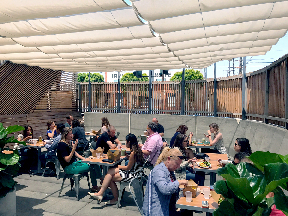 People in the courtyard at Little Ground