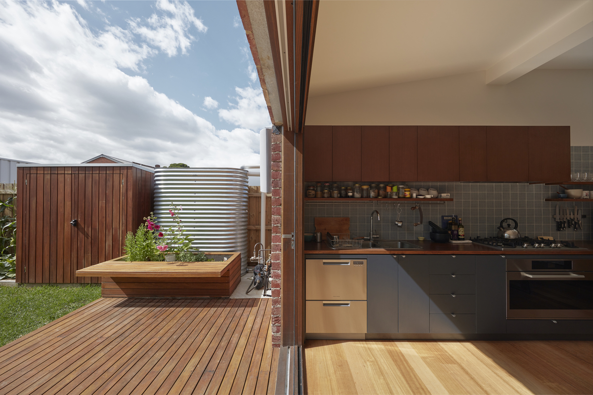 The outdoor space and kitchen of a compact Melbourne home