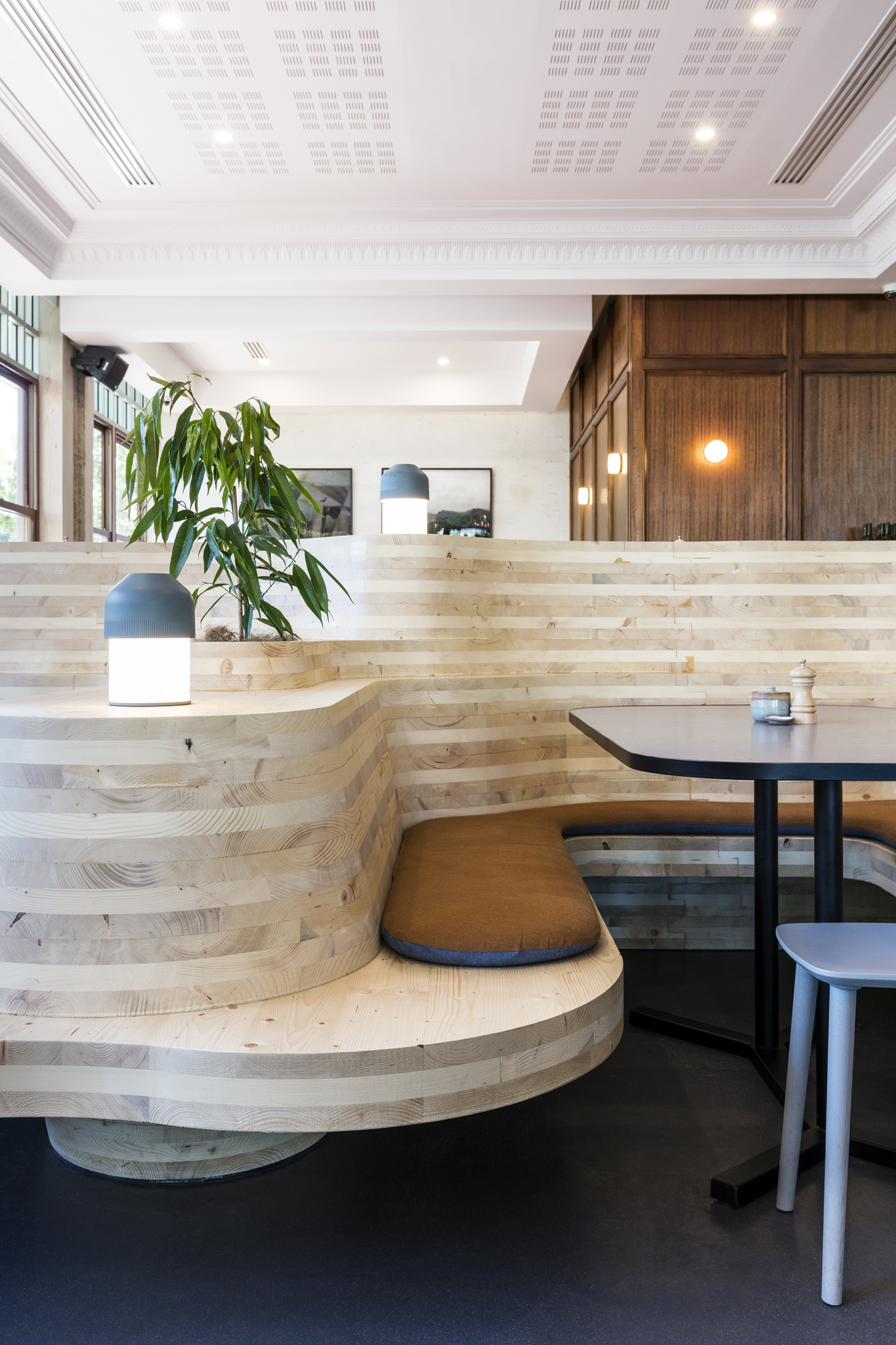 CLT panels were CNC-cut to form seating booths and stairs to a raised platform