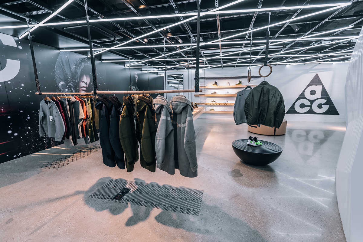 Clothing hangs from the roof in the Nike Lab store