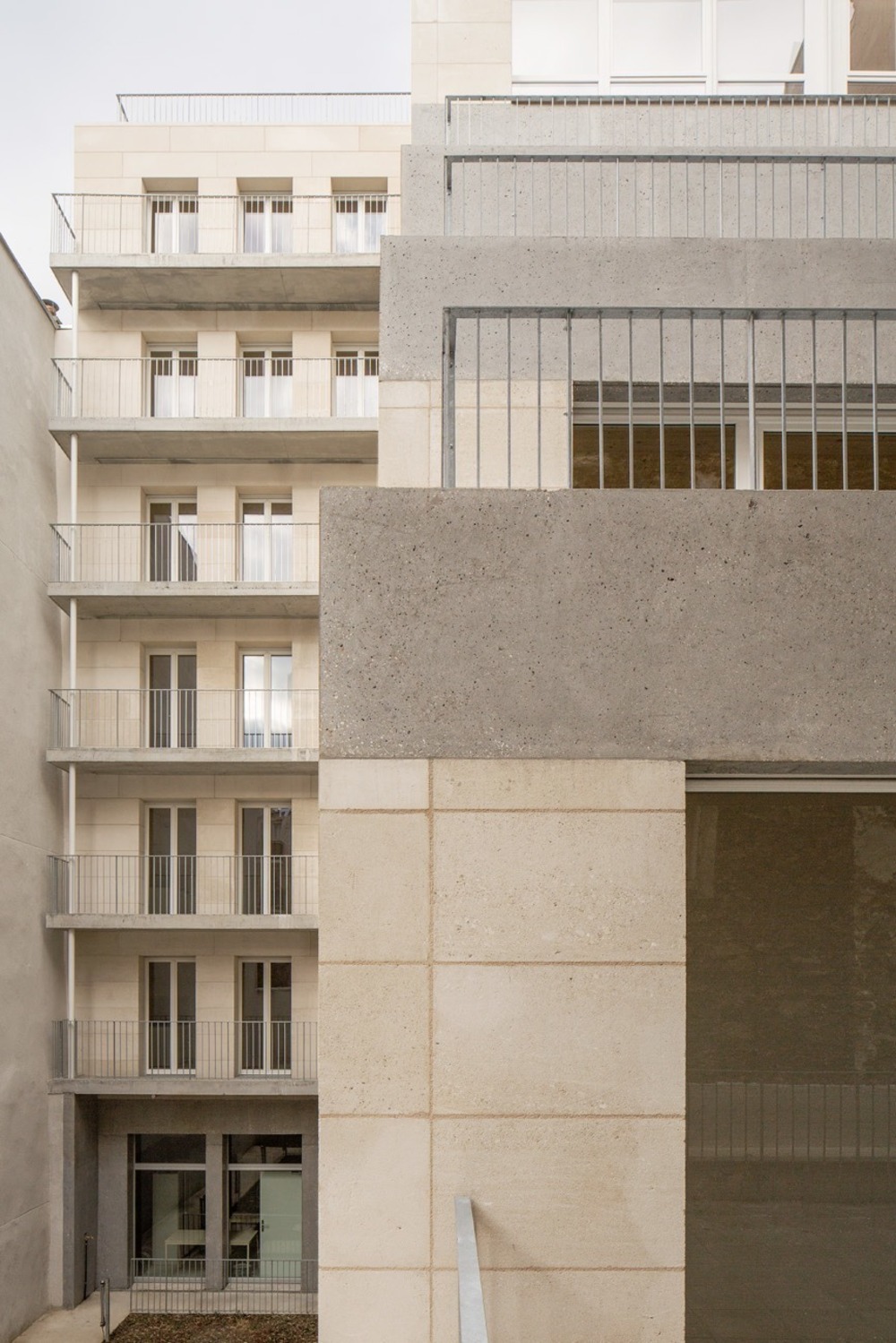 Stone social housing project by Barrault Pressacco