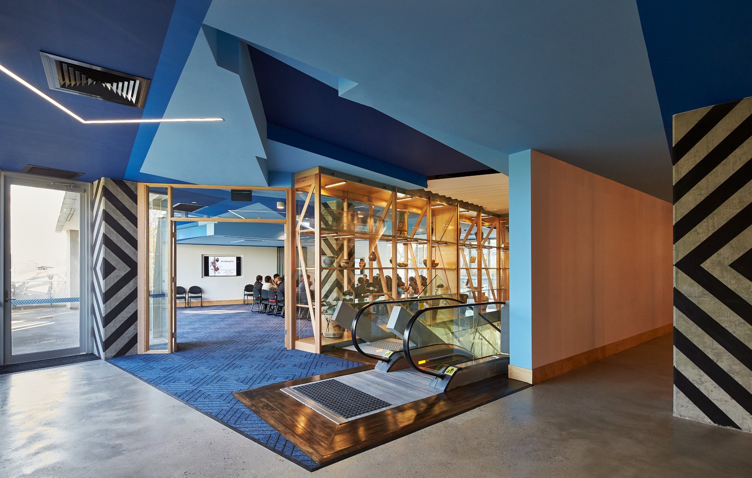 Blue interior with escalator of Koorie Heritage Trust