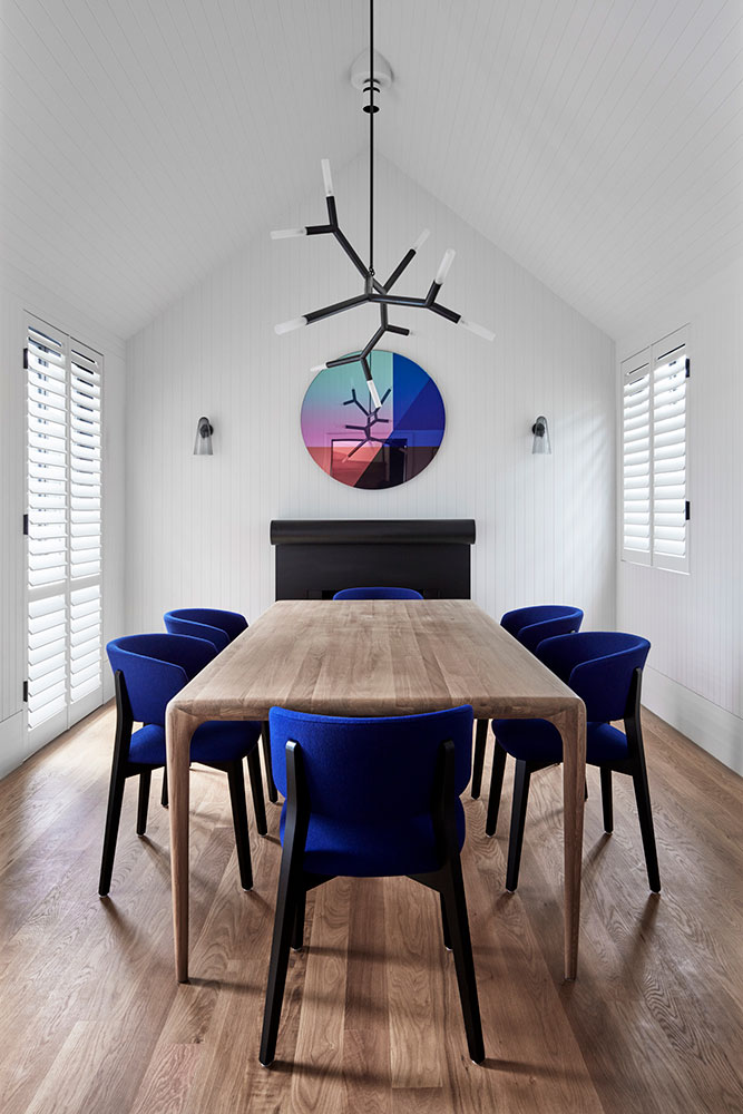 Timber-lined ceiling follows the pitched roof in the formal dining room