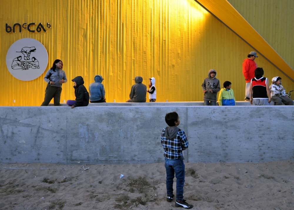 Children playing in the front of the building