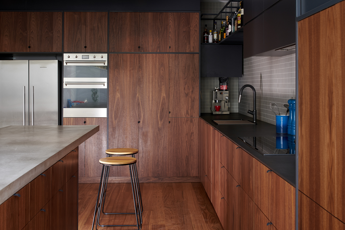 The kitchen is made from wood and steel