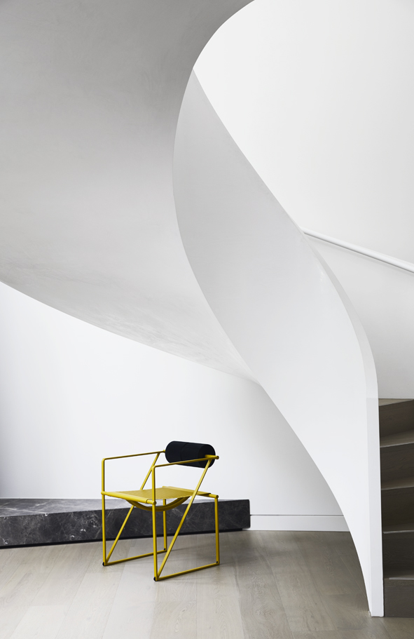 Spiral staircase and yellow chair