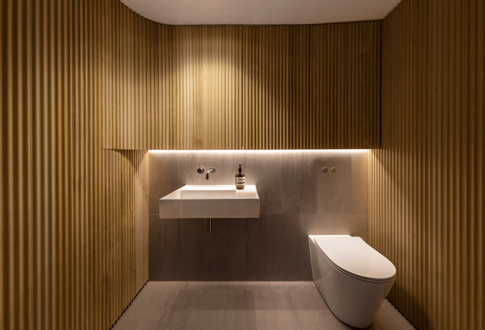 The bathroom in the manly apartment is modern
