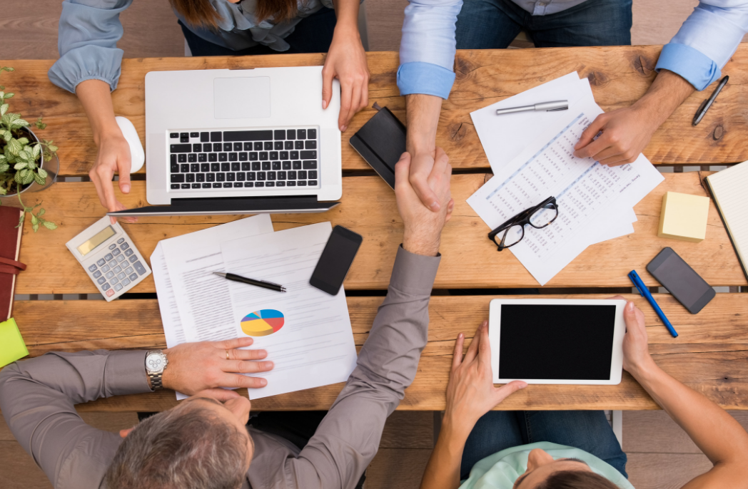 People shaking hands at a business meeting