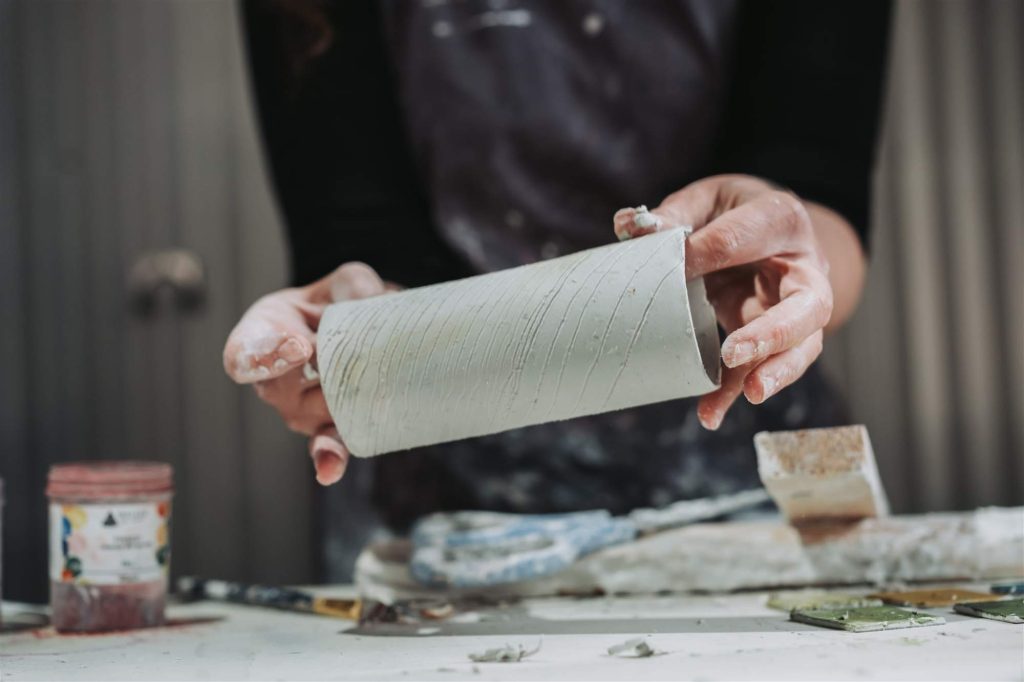 Crafting sustainable artwork in the studio.