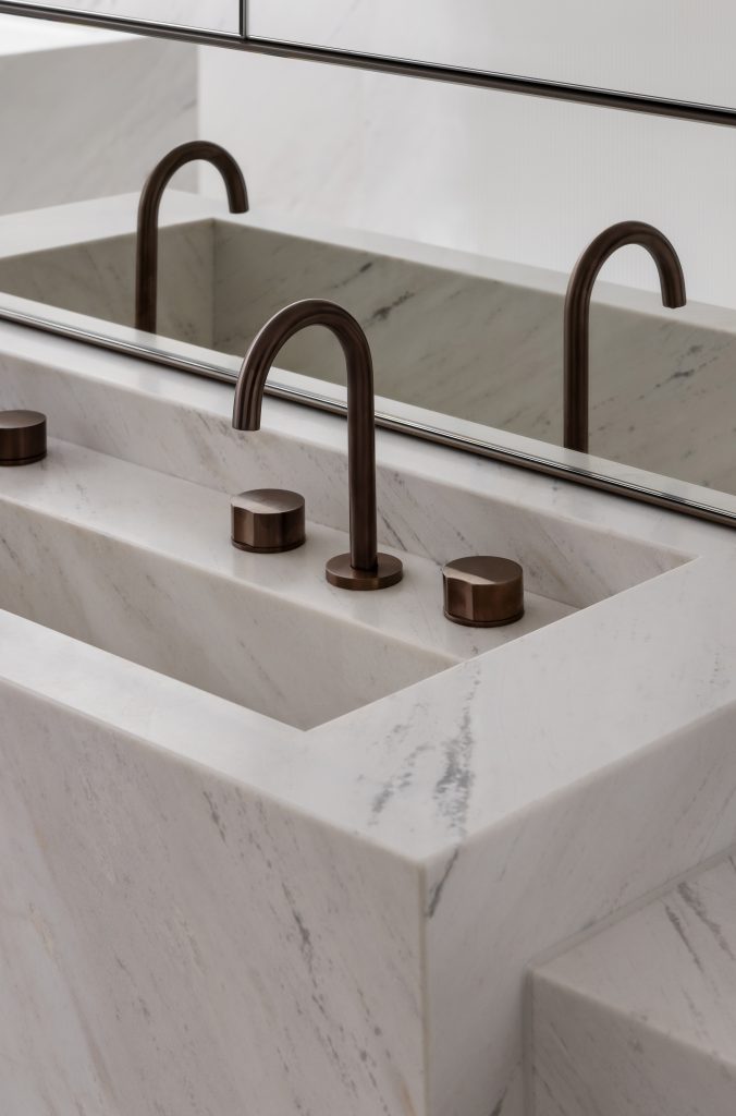 Another beautifully crafted bathroom sink with contrasting hardware.