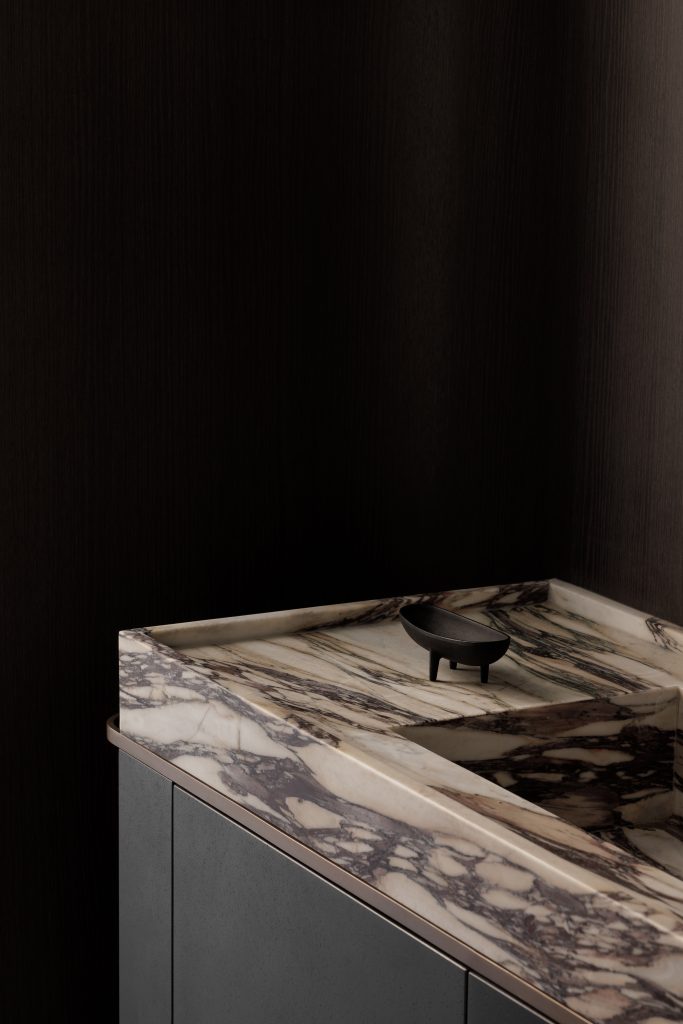 The details on this beautiful hand crafted vanity and sink transform the bathroom into a work of art in its own right.
