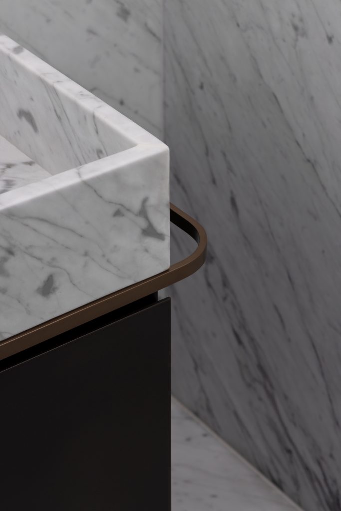 The elegant towel rail is a functional design detail.