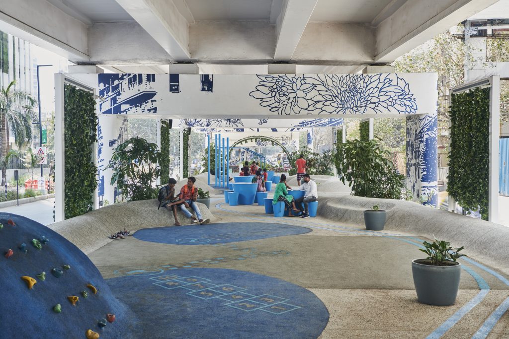 Turning an overbearing element of concrete infrastructure into a public space for the entire local community, the design adds much-needed amenities and greenery, improves mobility, and creates a strong visual identity for the area. On a broader scale, the design offers a repeatable approach to sustainable urban development that asserts a new benchmark for underused public spaces in the intense Indian metropolis.