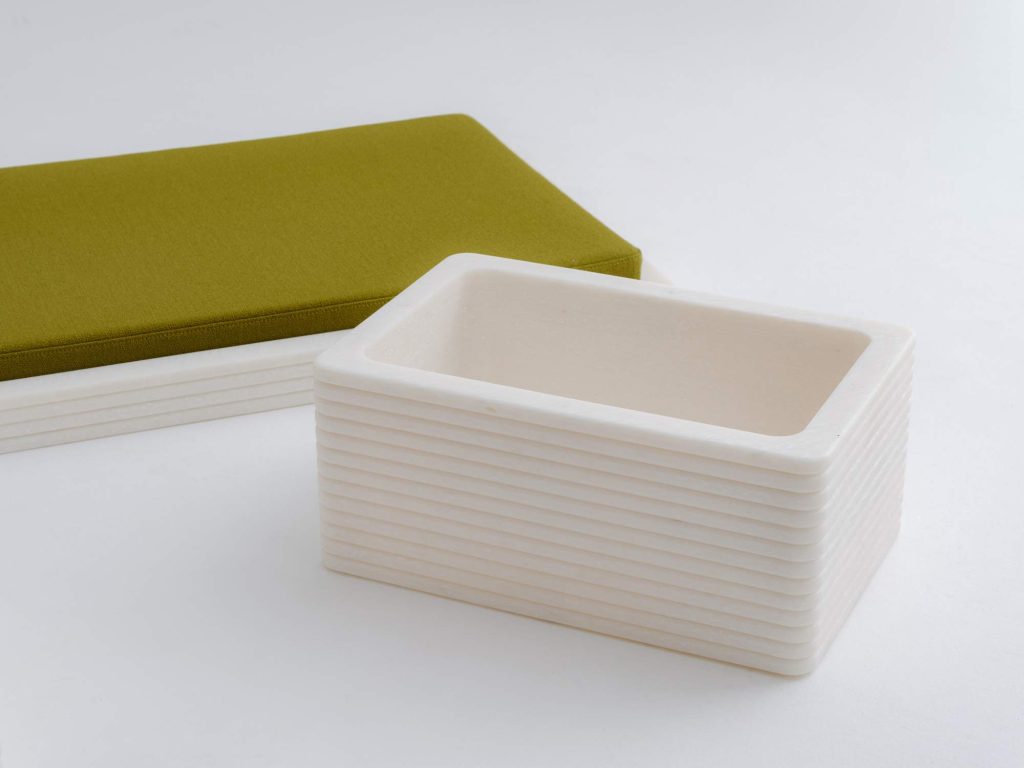 Marble-like recycled plastic base.