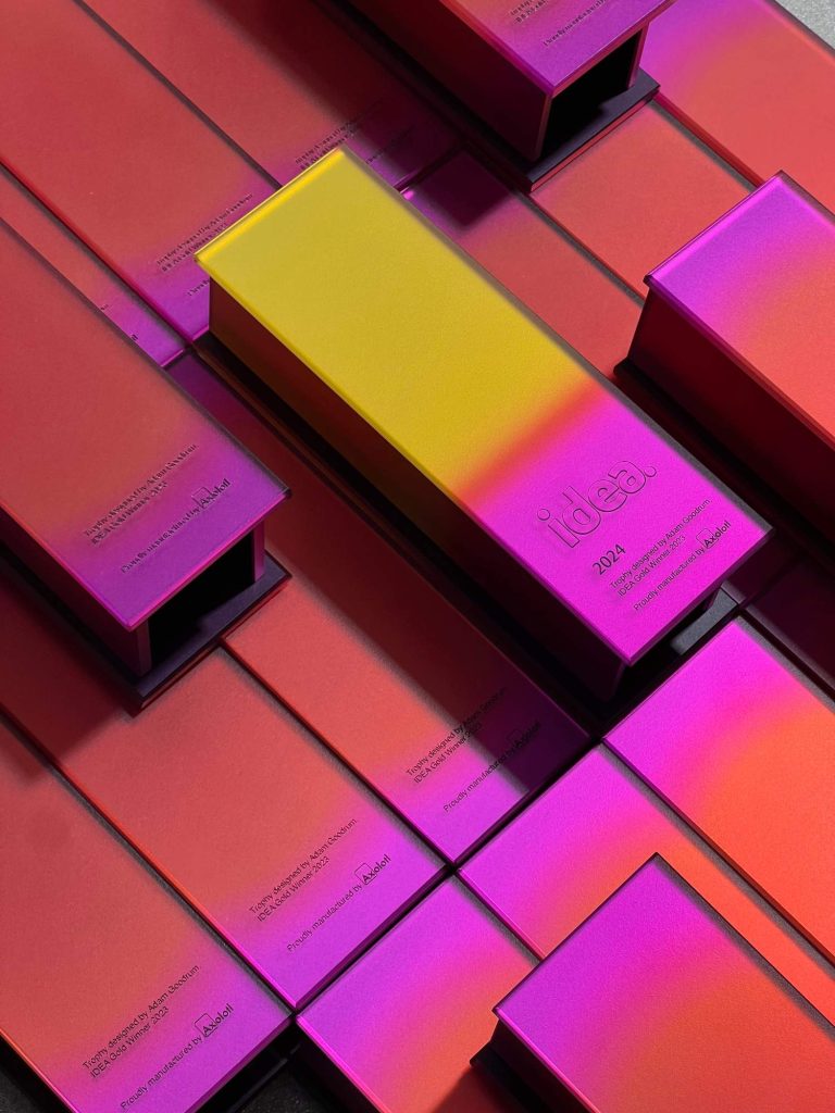 Joy and accomplishment are conveyed with a vibrant palette of coloured mirrored glass for the 2024 IDEA trophy.
