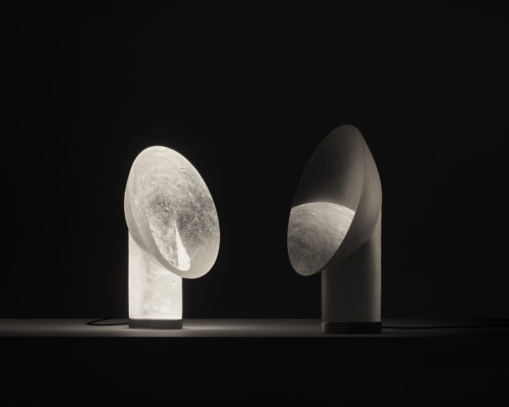 Two glass sculptural pieces against a black backdrop. Ross Gardam