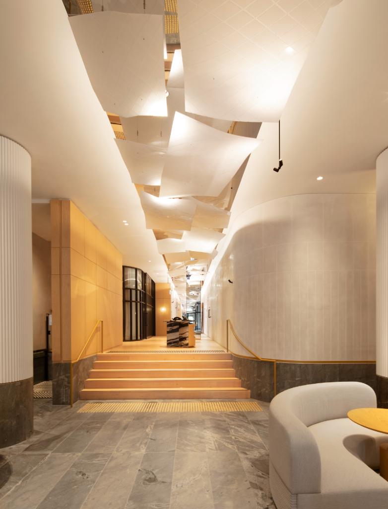 Lanson Place, a hallway with a large artwok looking like separated ceiling panels