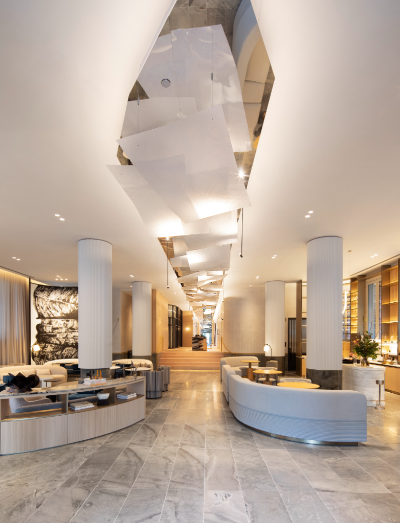 Lanson Place. Interior of lobby with geometrically cut ceiling, plus pillars and benches